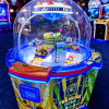 Colorful Treasure Dome arcade prize machine with a clear dome housing spinning toys and blue LED lights.